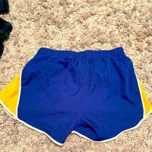 Blue and gold athletic shorts